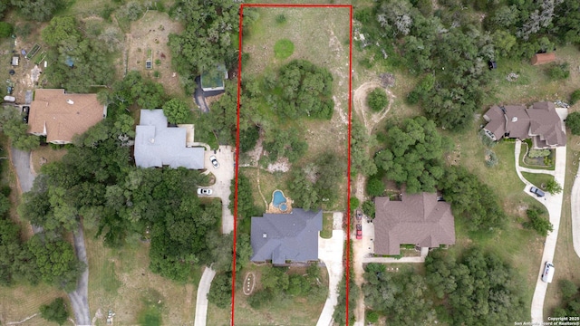 birds eye view of property with a residential view