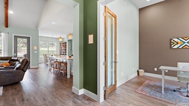 hall with baseboards, recessed lighting, and wood finished floors