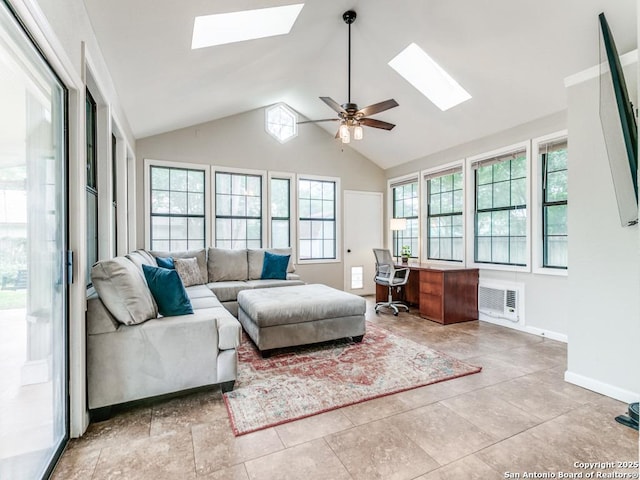 14051 Cedar Cyn, San Antonio, TX 78231 - living room featuring ceiling fan, baseboards, and vaulted ceiling with skylight