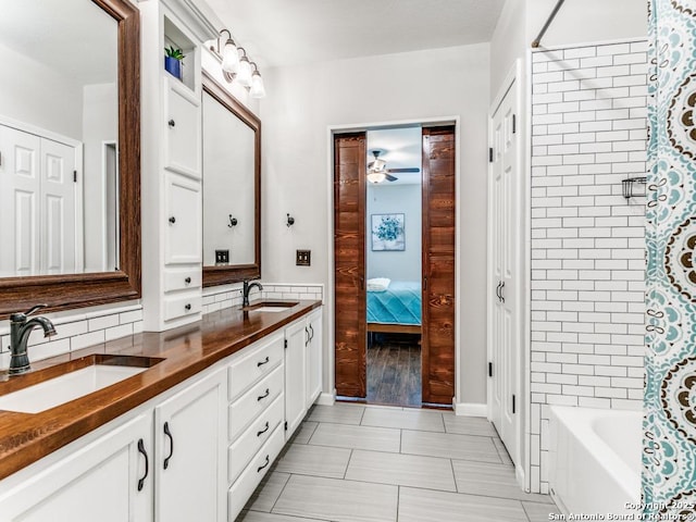 14051 Cedar Cyn, San Antonio, TX 78231 - full bath with a sink, tile patterned floors, ceiling fan, and double vanity