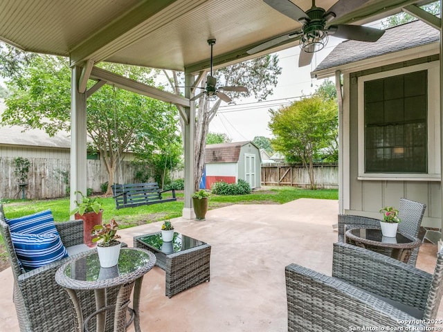 14051 Cedar Cyn, San Antonio, TX 78231 - view of patio / terrace with a storage shed, an outbuilding, a ceiling fan, and a fenced backyard