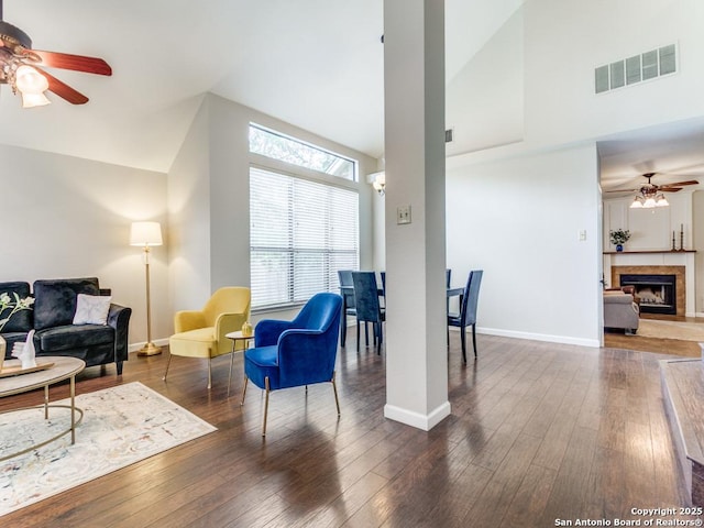 14051 Cedar Cyn, San Antonio, TX 78231 - living room with visible vents, hardwood / wood-style floors, baseboards, high vaulted ceiling, and a ceiling fan