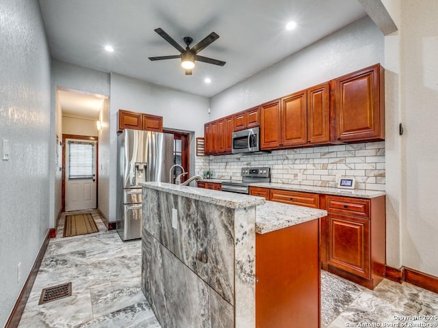 1520 Virginia, San Antonio, TX 78203 - kitchen featuring a ceiling fan, backsplash, visible vents, baseboards, and stainless steel appliances
