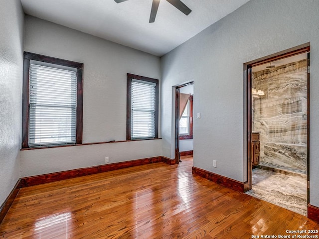 1520 Virginia, San Antonio, TX 78203 - spare room with plenty of natural light, baseboards, ceiling fan, and wood finished floors