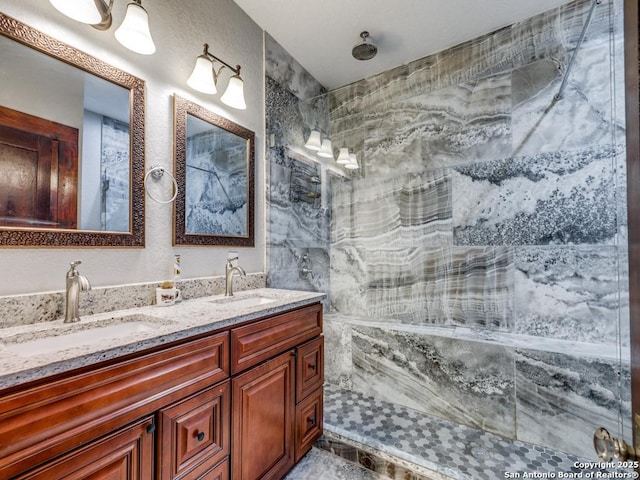 1520 Virginia, San Antonio, TX 78203 - bathroom with a sink, a shower, and double vanity