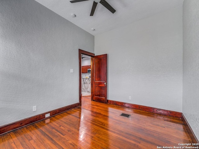 1520 Virginia, San Antonio, TX 78203 - empty room with a ceiling fan, baseboards, and wood finished floors