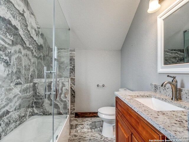 1520 Virginia, San Antonio, TX 78203 - bathroom featuring vanity, marble finish floor, toilet, baseboards, and combined bath / shower with glass door