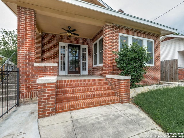 1520 Virginia, San Antonio, TX 78203 - property entrance with fence, a ceiling fan, and brick siding