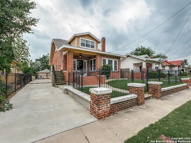 1520 Virginia, San Antonio, TX 78203 - bungalow featuring brick siding, a front yard, a chimney, a ceiling fan, and covered porch