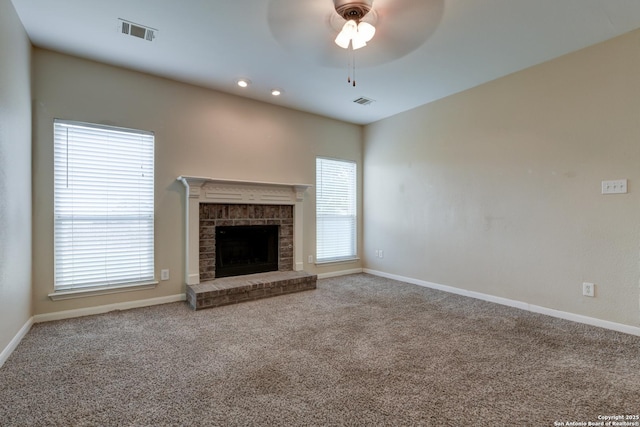 3622 Mill Mdw, San Antonio, TX 78247 - unfurnished living room featuring ceiling fan, carpet flooring, a brick fireplace, and baseboards