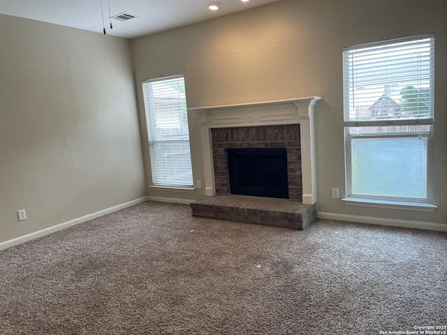 3622 Mill Mdw, San Antonio, TX 78247 - unfurnished living room featuring carpet, baseboards, and a fireplace