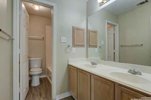 3622 Mill Mdw, San Antonio, TX 78247 - full bath featuring toilet, wood finished floors, double vanity, and baseboards