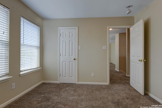 3622 Mill Mdw, San Antonio, TX 78247 - unfurnished bedroom featuring carpet floors, multiple windows, and baseboards