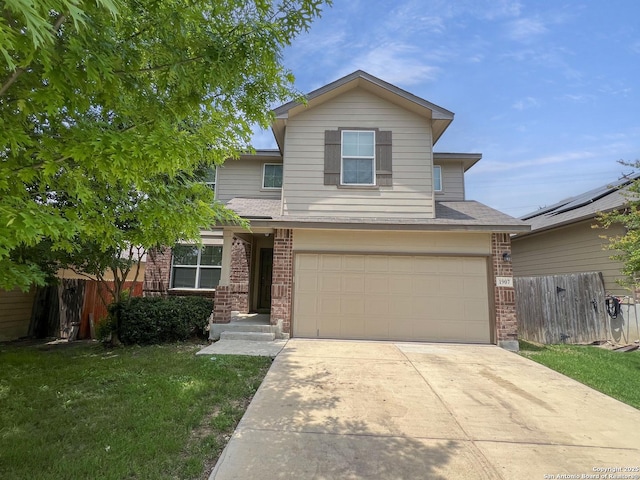 traditional-style home featuring fence, concrete driveway, a garage, and brick siding