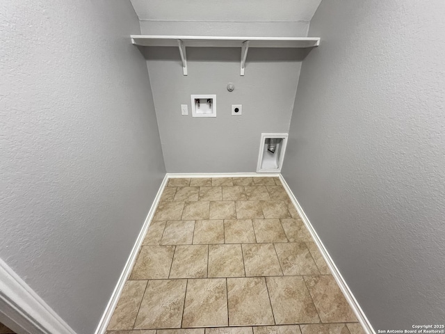 washroom with laundry area, baseboards, stone finish floor, electric dryer hookup, and washer hookup