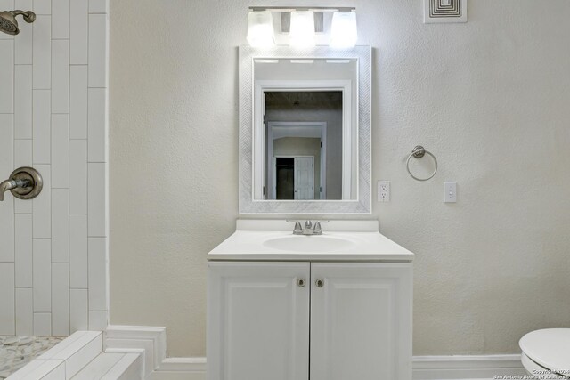 1932 W Huisache, San Antonio, TX 78201 - full bathroom featuring vanity, toilet, and tiled shower