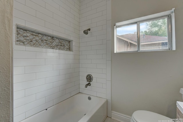 1932 W Huisache, San Antonio, TX 78201 - bathroom featuring baseboards, toilet, and tub / shower combination