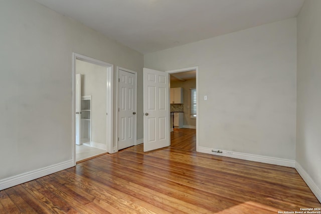 1932 W Huisache, San Antonio, TX 78201 - unfurnished bedroom featuring light wood-style floors and baseboards