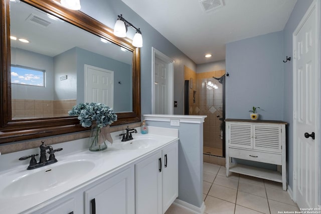 full bathroom with visible vents, a sink, and tile patterned flooring