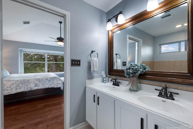 ensuite bathroom featuring a sink, ensuite bathroom, and visible vents