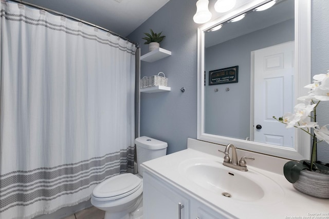 full bathroom with vanity, toilet, and a shower with shower curtain