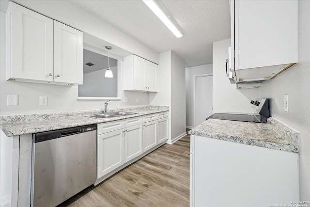 kitchen with dishwasher, white cabinets, a sink, light wood finished floors, and range