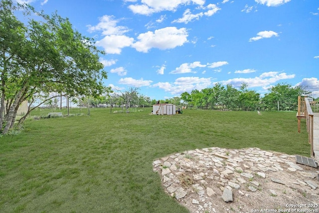 769 Kristen Ln, Harper, TX 78631 - view of yard featuring a storage unit and an outbuilding