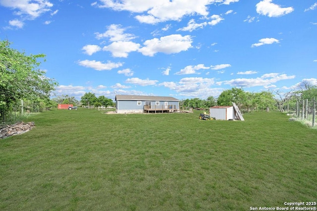 769 Kristen Ln, Harper, TX 78631 - view of yard featuring a storage shed, an outbuilding, and a wooden deck