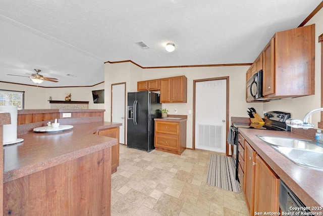 769 Kristen Ln, Harper, TX 78631 - kitchen featuring brown cabinets, crown molding, lofted ceiling, visible vents, and black appliances