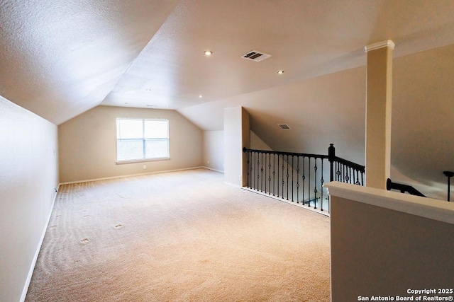 26923 Trinity Hts, San Antonio, TX 78261 - additional living space with carpet floors, baseboards, visible vents, and lofted ceiling
