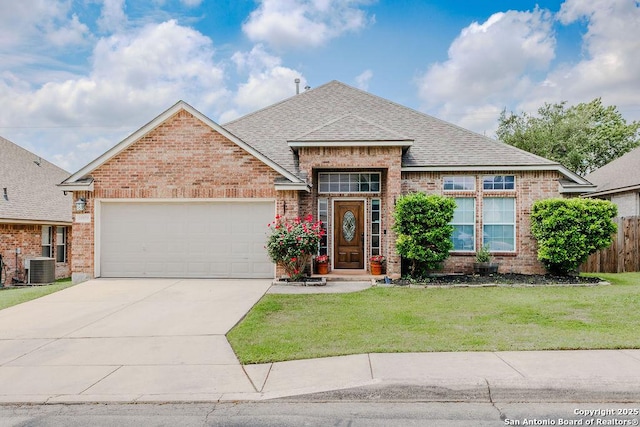 26923 Trinity Hts, San Antonio, TX 78261 - view of front facade with brick siding, an attached garage, roof with shingles, and a front yard