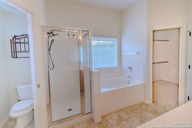 26923 Trinity Hts, San Antonio, TX 78261 - full bathroom with toilet, tile patterned floors, a shower stall, and a garden tub