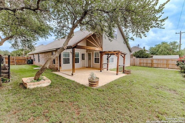 26923 Trinity Hts, San Antonio, TX 78261 - rear view of house featuring a fenced backyard, a patio area, and a yard