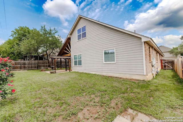 26923 Trinity Hts, San Antonio, TX 78261 - rear view of property with a yard, a patio, and a fenced backyard