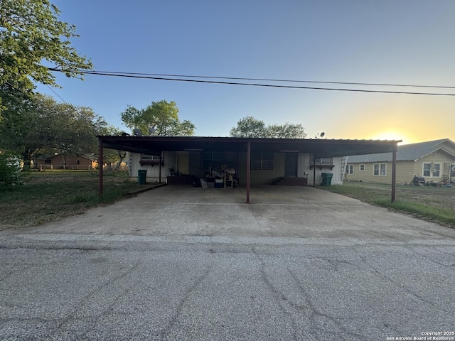 704 Cantrell, Jourdanton, TX 78026 - view of front facade with an attached carport and driveway