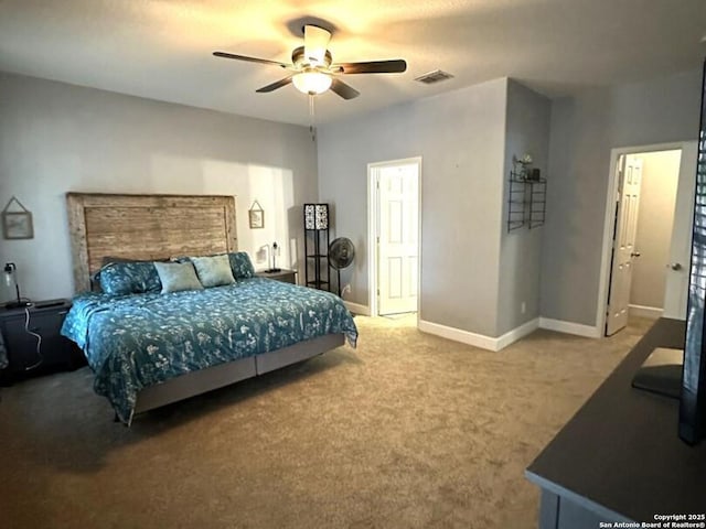 carpeted bedroom featuring a ceiling fan, baseboards, and visible vents
