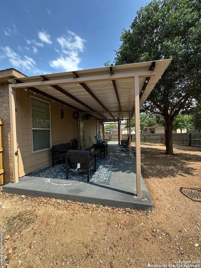 view of patio / terrace featuring fence