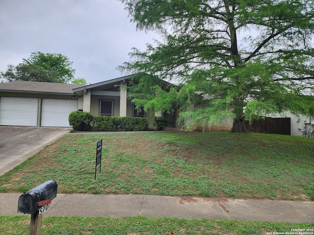 view of front of home featuring driveway and a garage