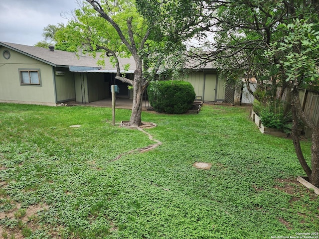 view of yard with fence