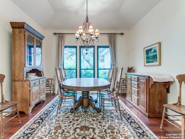 13907 Bluffmont, San Antonio, TX 78216 - dining space featuring a notable chandelier, vaulted ceiling, and dark wood-type flooring