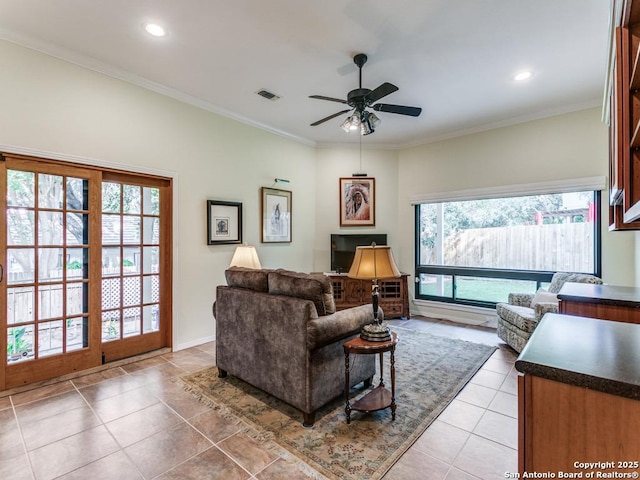 13907 Bluffmont, San Antonio, TX 78216 - living room with light tile patterned flooring, a ceiling fan, recessed lighting, visible vents, and ornamental molding