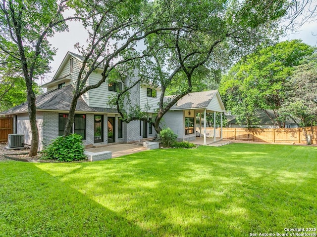 13907 Bluffmont, San Antonio, TX 78216 - rear view of house featuring a patio area, a yard, and cooling unit