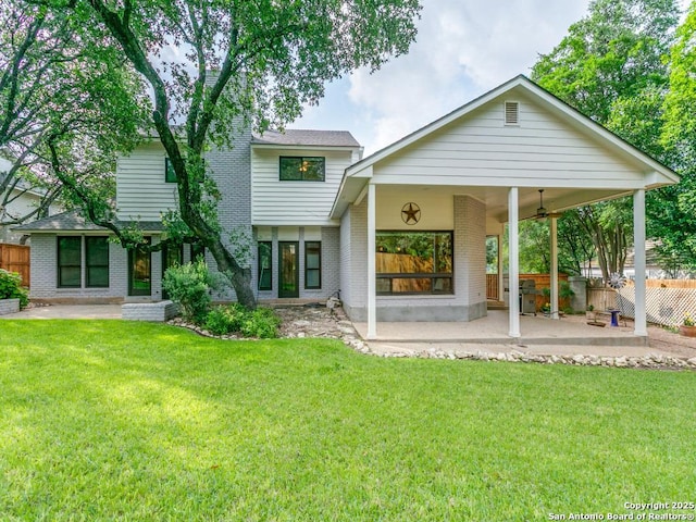 13907 Bluffmont, San Antonio, TX 78216 - back of property with fence, a patio area, and brick siding