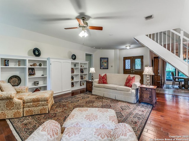 13907 Bluffmont, San Antonio, TX 78216 - living area with wood-type flooring, stairs, ceiling fan, and visible vents