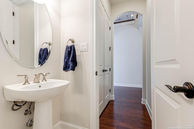 2623 Galit Cv, San Antonio, TX 78230 - bathroom featuring baseboards, a sink, and hardwood / wood-style floors