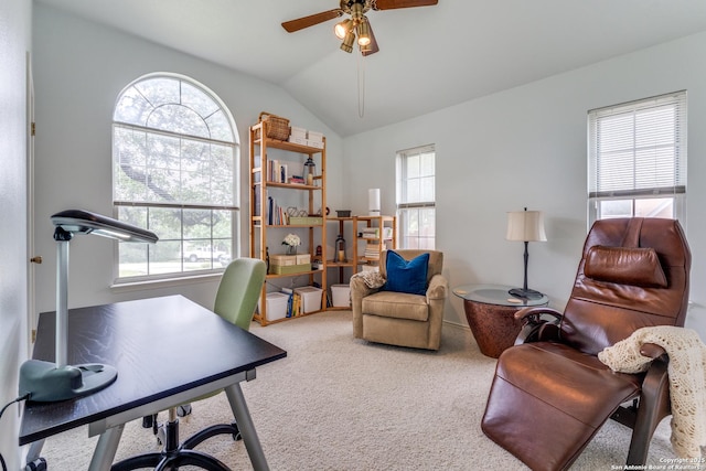 carpeted home office featuring ceiling fan and vaulted ceiling