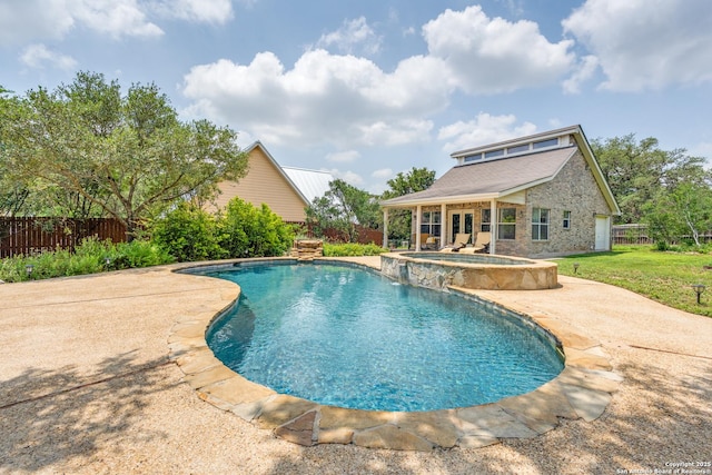 view of pool featuring a fenced backyard, an outbuilding, a patio area, a pool with connected hot tub, and a yard