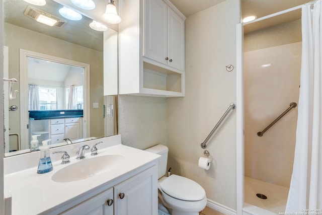 full bathroom featuring toilet, visible vents, a shower stall, and vanity