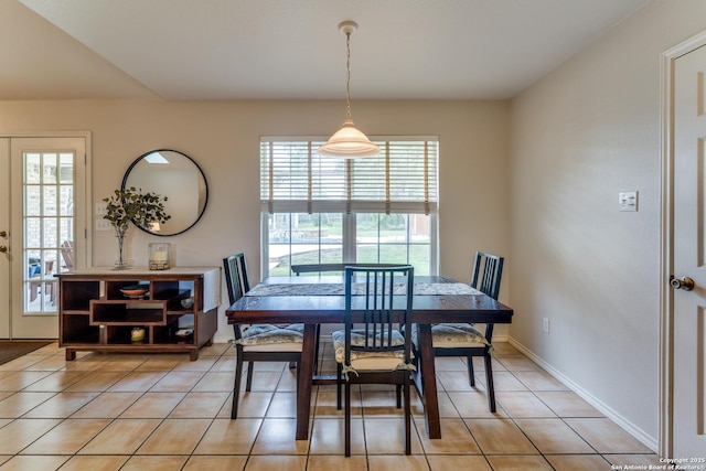 dining area with light tile patterned floors and baseboards