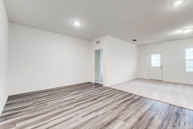 5014 Jovian, San Antonio, TX 78245 - spare room featuring baseboards, recessed lighting, light wood-style flooring, and visible vents